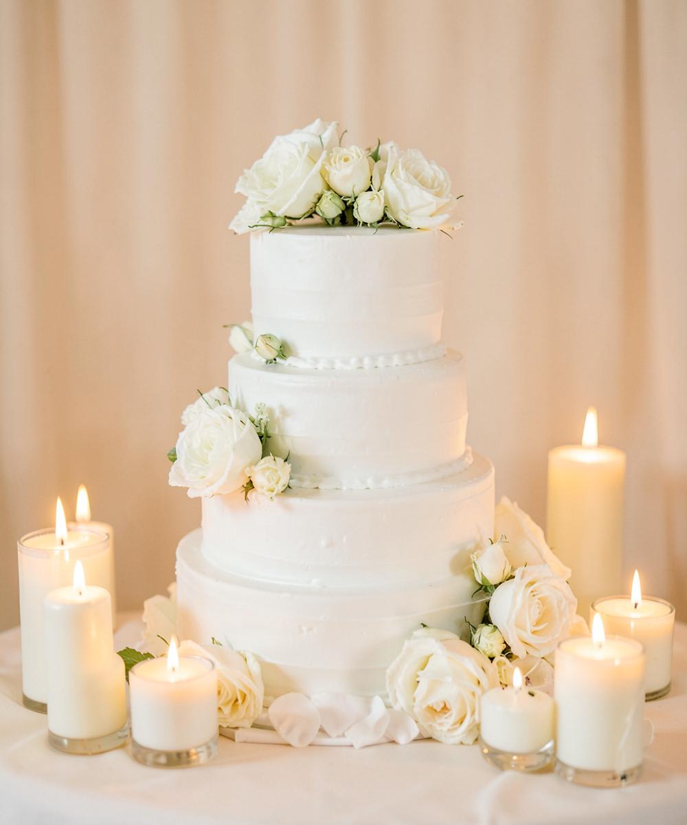 White wedding cake with roses